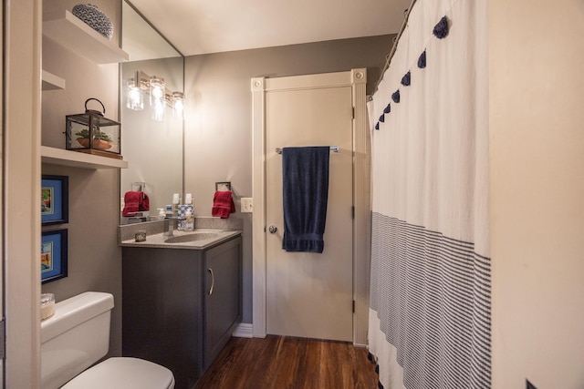 2513 Aspen Ln SW, Rochester, MN 55902 - full bathroom with wood finished floors, toilet, vanity, and a shower with shower curtain