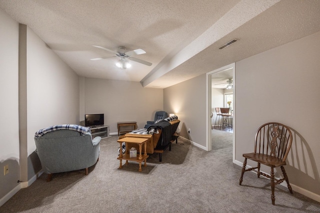 2513 Aspen Ln SW, Rochester, MN 55902 - carpeted living area with ceiling fan, a textured ceiling, and baseboards