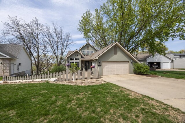2513 Aspen Ln SW, Rochester, MN 55902 - view of front of house with a garage, concrete driveway, and stucco siding