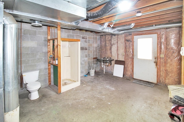 below grade area with concrete block wall