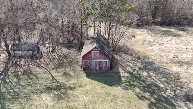 view from above of property with a heavily wooded area