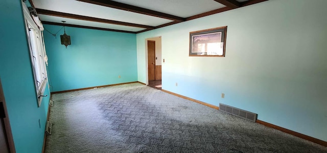 410 Wedgewood Rd, Albert Lea, MN 56007 - spare room featuring beam ceiling, carpet, and baseboards