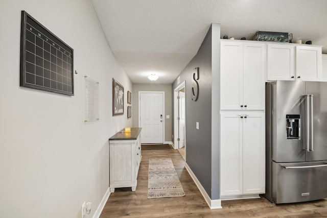 7516 Ochoa Ave NE, Otsego, MN 55330 - hallway with wood finished floors and baseboards