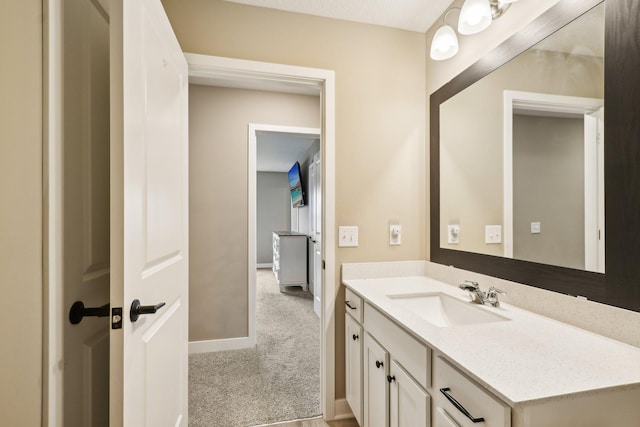 7516 Ochoa Ave NE, Otsego, MN 55330 - bathroom featuring vanity and baseboards