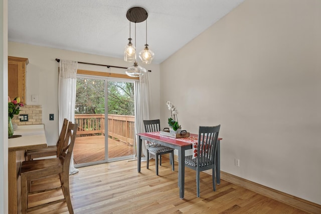 15110 Ute St NW, Ramsey, MN 55303 - dining area with light wood-style flooring and baseboards