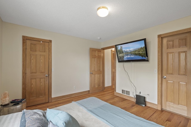 15110 Ute St NW, Ramsey, MN 55303 - bedroom with wood finished floors and baseboards