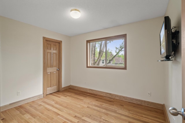 15110 Ute St NW, Ramsey, MN 55303 - unfurnished room featuring light wood finished floors and baseboards