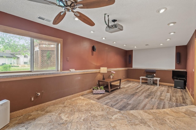 15110 Ute St NW, Ramsey, MN 55303 - sitting room with baseboards, ceiling fan, recessed lighting, and a textured ceiling
