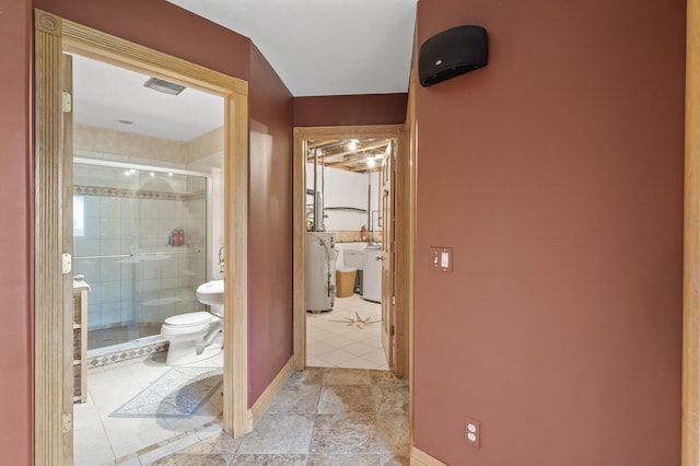 15110 Ute St NW, Ramsey, MN 55303 - full bath with water heater, a shower stall, toilet, baseboards, and tile patterned floors