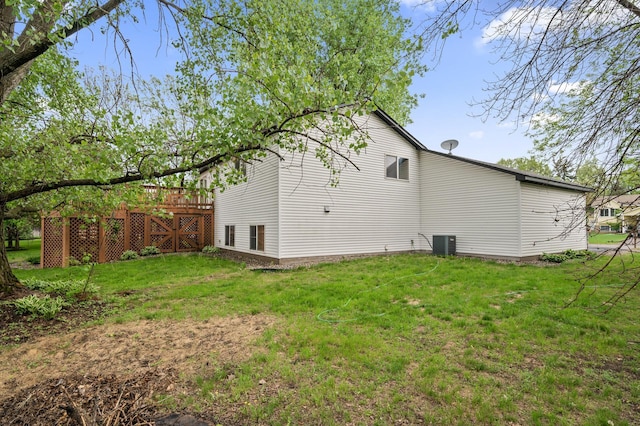 15110 Ute St NW, Ramsey, MN 55303 - view of side of property featuring a yard, central air condition unit, and a wooden deck