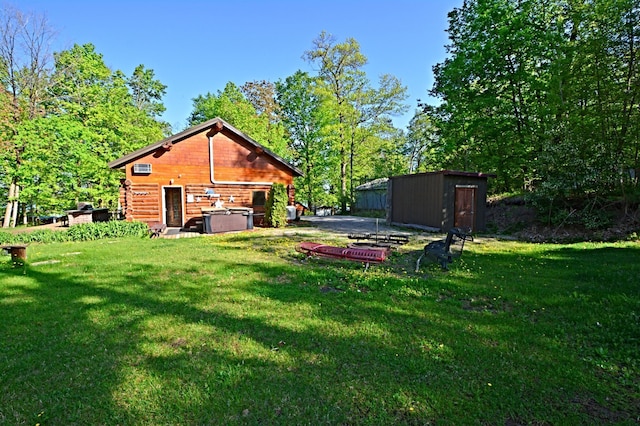 17377 Paradise Shores Rd, Maple Grove Twp, MN 56401 - view of green lawn with an outbuilding and a storage unit