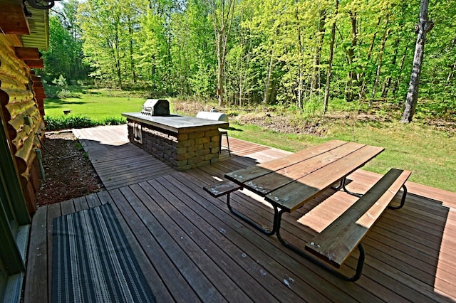 17377 Paradise Shores Rd, Maple Grove Twp, MN 56401 - deck featuring a yard, outdoor dining area, and a forest view