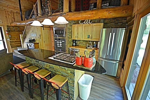 17377 Paradise Shores Rd, Maple Grove Twp, MN 56401 - kitchen featuring stainless steel appliances, plenty of natural light, high vaulted ceiling, dark wood finished floors, and a sink