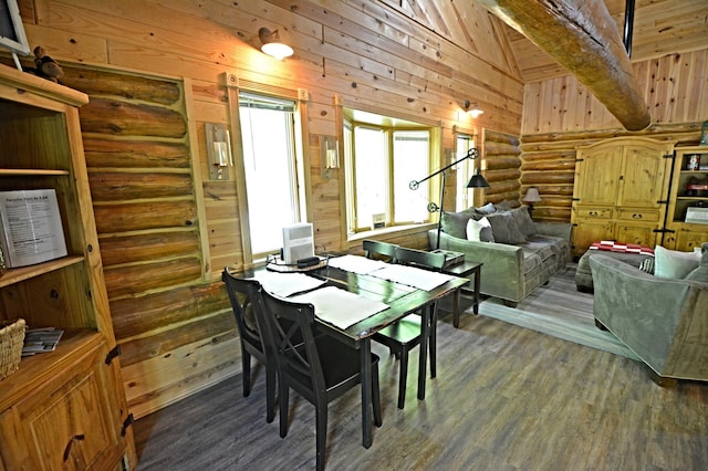 17377 Paradise Shores Rd, Maple Grove Twp, MN 56401 - dining space featuring rustic walls, wood finished floors, wooden walls, and vaulted ceiling