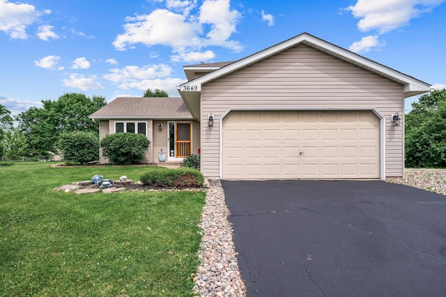 3649 Tower Pond Dr, Anoka, MN 55303 - view of front of property featuring asphalt driveway, a front yard, and a garage