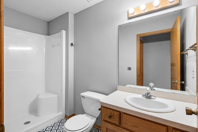 3649 Tower Pond Dr, Anoka, MN 55303 - bathroom with a shower, vanity, and a textured ceiling
