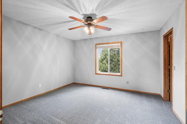 3649 Tower Pond Dr, Anoka, MN 55303 - unfurnished room with carpet, a ceiling fan, and a textured ceiling