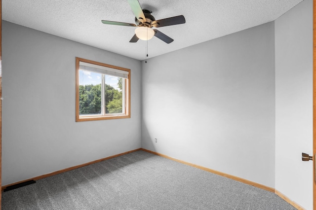 3649 Tower Pond Dr, Anoka, MN 55303 - empty room featuring ceiling fan, carpet, and a textured ceiling