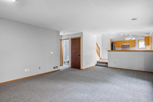 3649 Tower Pond Dr, Anoka, MN 55303 - unfurnished living room featuring carpet and stairs