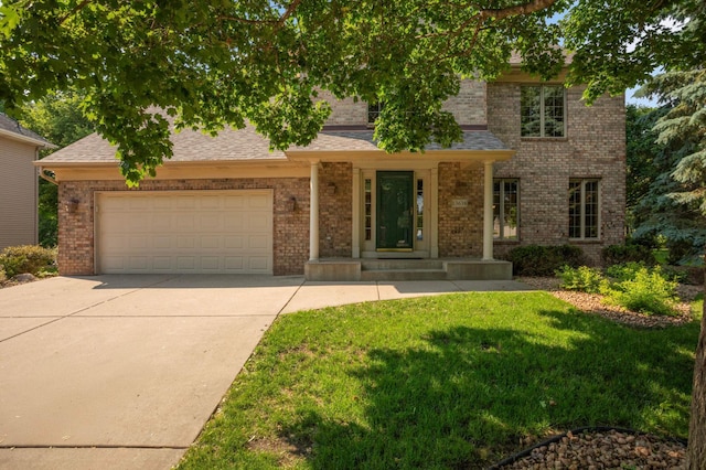 13638 43rd St NE, Saint Michael, MN 55376 - traditional-style house with concrete driveway, an attached garage, a front yard, and brick siding