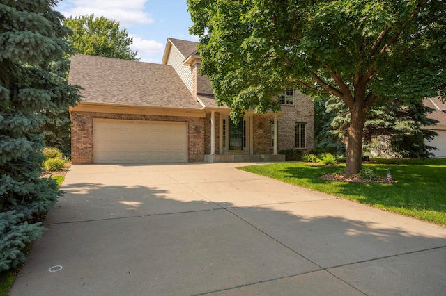 13638 43rd St NE, Saint Michael, MN 55376 - view of front of house featuring an attached garage, brick siding, driveway, and a front yard