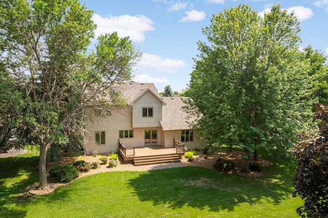 13638 43rd St NE, Saint Michael, MN 55376 - back of property featuring a wooden deck, a lawn, and a shingled roof
