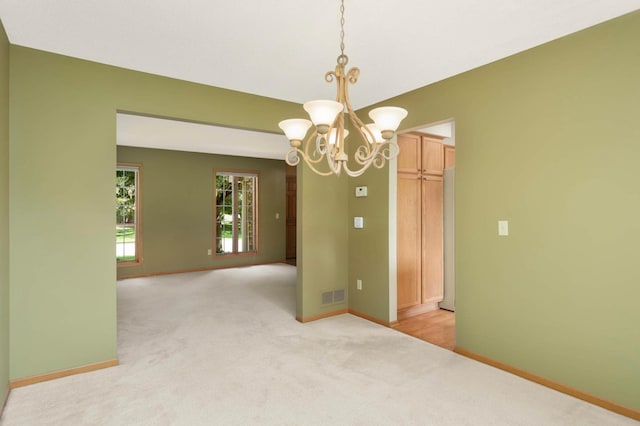 13638 43rd St NE, Saint Michael, MN 55376 - unfurnished room with light carpet and a chandelier