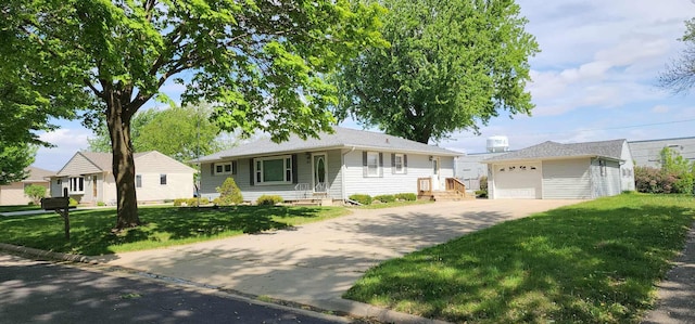 621 16th St, Albert Lea, MN 56007 - ranch-style home featuring concrete driveway, an outbuilding, a detached garage, and a front lawn
