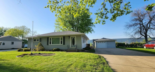 621 16th St, Albert Lea, MN 56007 - view of front of property with an outdoor structure, a garage, driveway, a front yard, and entry steps