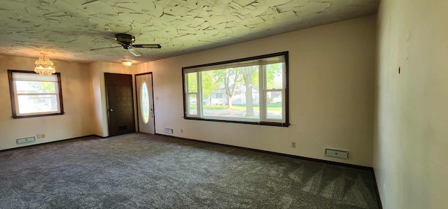 621 16th St, Albert Lea, MN 56007 - empty room featuring carpet, a chandelier, plenty of natural light, and baseboards