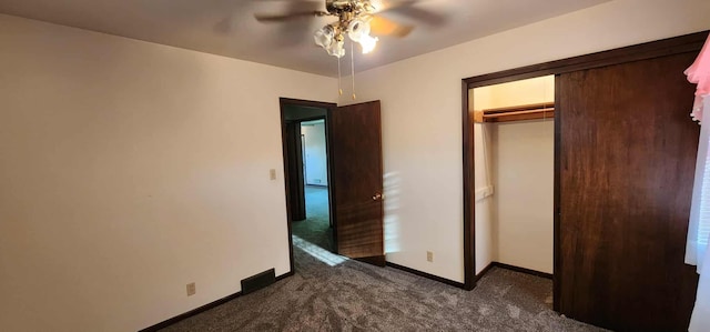 621 16th St, Albert Lea, MN 56007 - unfurnished bedroom with dark carpet, baseboards, a closet, and a ceiling fan