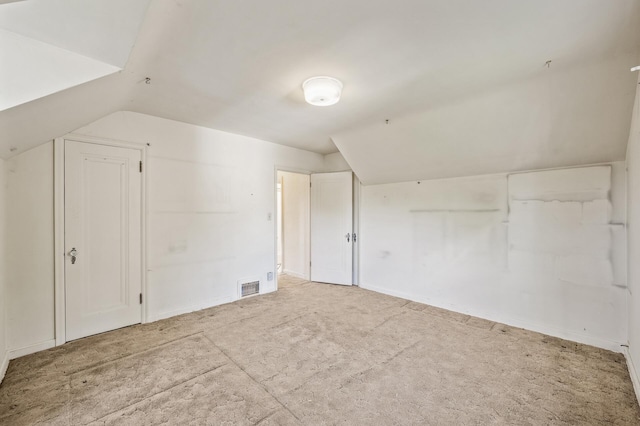 bonus room featuring vaulted ceiling, baseboards, and carpet flooring