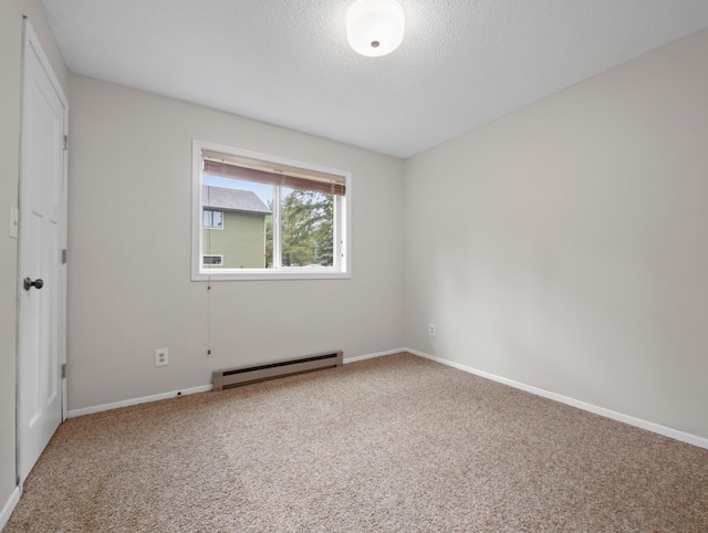 2908 Crestwood Dr NE, Alexandria Twp, MN 56308 - unfurnished bedroom featuring baseboard heating, carpet, and a textured ceiling