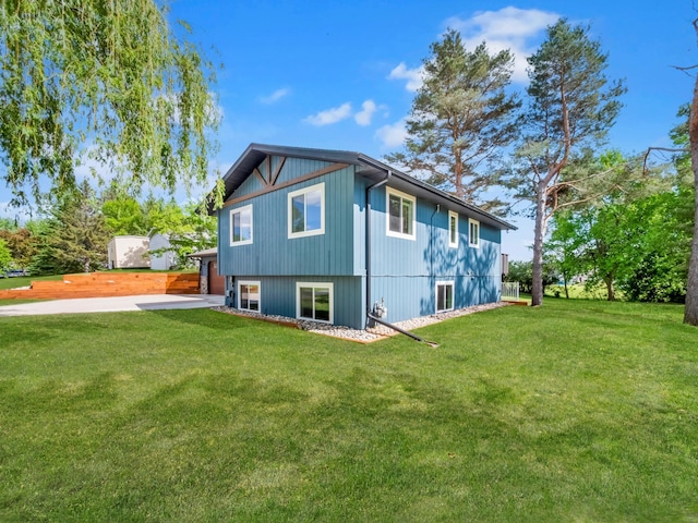 2908 Crestwood Dr NE, Alexandria Twp, MN 56308 - rear view of property with a lawn and concrete driveway
