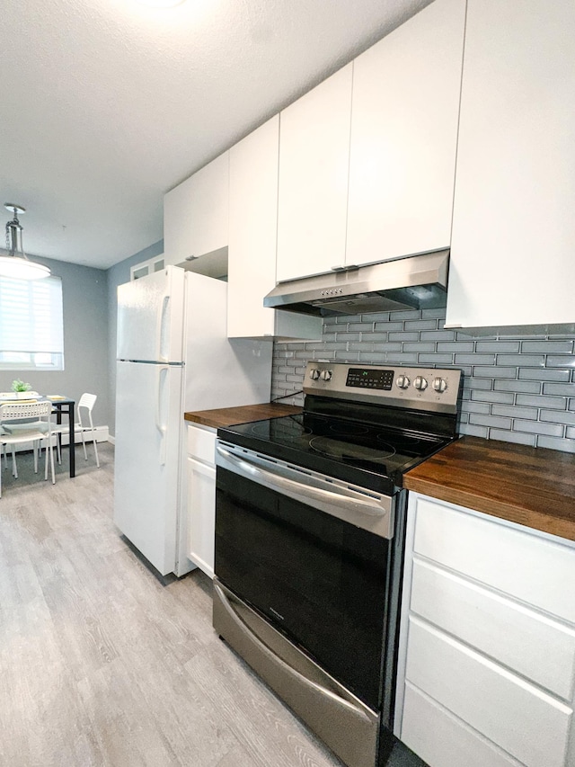 4407 Wilshire Blvd Unit 110, Mound, MN 55364 - kitchen featuring stainless steel range with electric stovetop, under cabinet range hood, butcher block counters, light wood-style flooring, and backsplash
