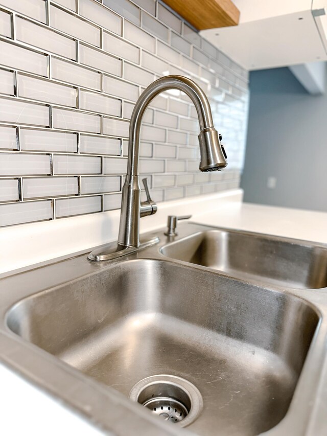 4407 Wilshire Blvd Unit 110, Mound, MN 55364 - kitchen view of a sink and tasteful backsplash
