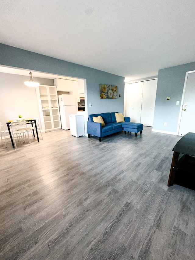 4407 Wilshire Blvd Unit 110, Mound, MN 55364 - living room with wood finished floors and baseboards