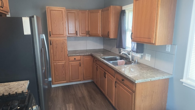 1339 Payne Ave, Saint Paul, MN 55101 - kitchen featuring freestanding refrigerator, a sink, backsplash, and healthy amount of natural light