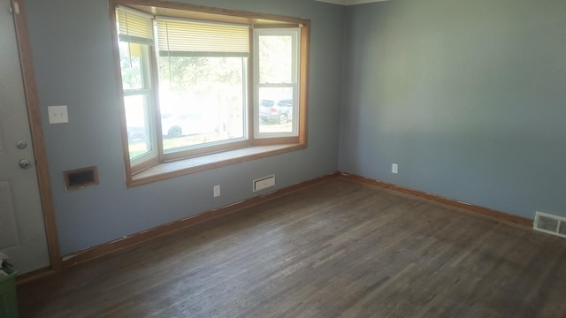 1339 Payne Ave, Saint Paul, MN 55101 - spare room with baseboards and dark wood-style flooring