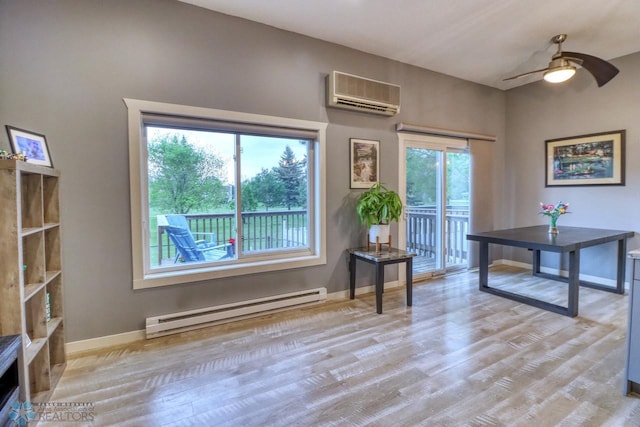 2814 26th Street Cir S, Moorhead, MN 56560 - office space featuring a baseboard radiator, an AC wall unit, wood finished floors, baseboards, and a ceiling fan