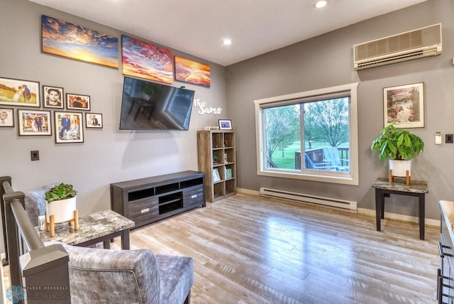 2814 26th Street Cir S, Moorhead, MN 56560 - living area featuring a baseboard radiator, an AC wall unit, wood finished floors, baseboards, and recessed lighting