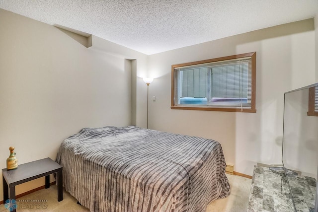 2814 26th Street Cir S, Moorhead, MN 56560 - carpeted bedroom featuring a textured ceiling and baseboards
