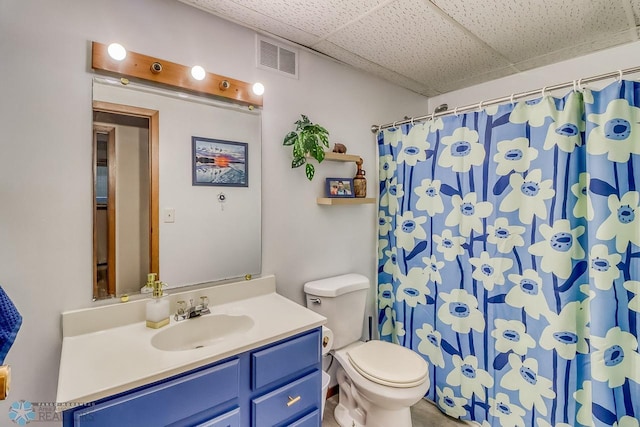 2814 26th Street Cir S, Moorhead, MN 56560 - bathroom featuring toilet, a drop ceiling, vanity, and a shower with curtain