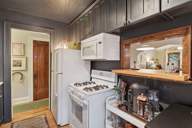 285 Cliff St Unit 4, Saint Paul, MN 55102 - kitchen with white appliances and light wood-style floors