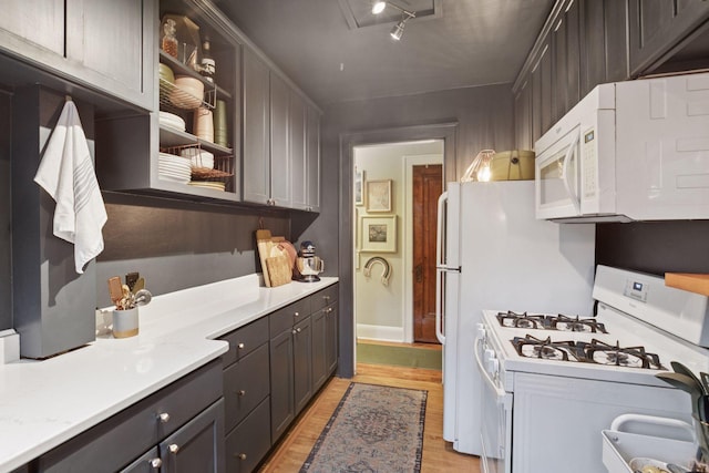 285 Cliff St Unit 4, Saint Paul, MN 55102 - kitchen with white appliances, light wood-style flooring, and light countertops