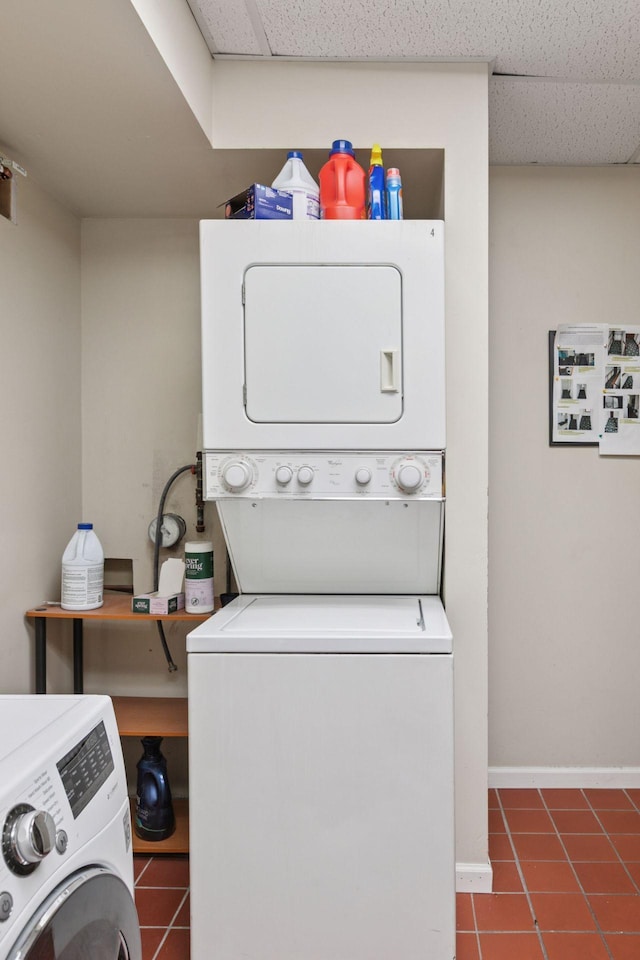 285 Cliff St Unit 4, Saint Paul, MN 55102 - washroom featuring stacked washer / drying machine, tile patterned flooring, and baseboards