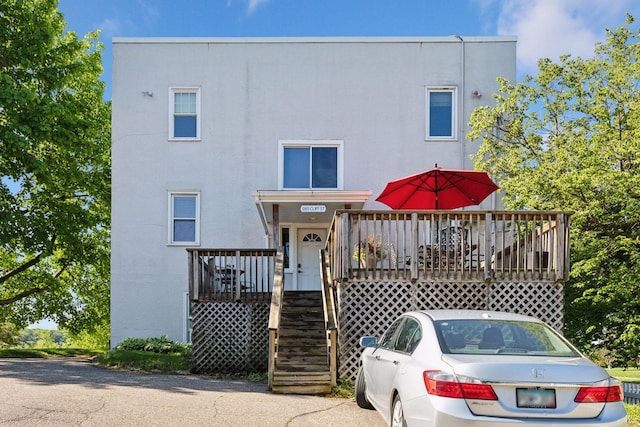 285 Cliff St Unit 4, Saint Paul, MN 55102 - view of front of property featuring stucco siding, a wooden deck, and stairway