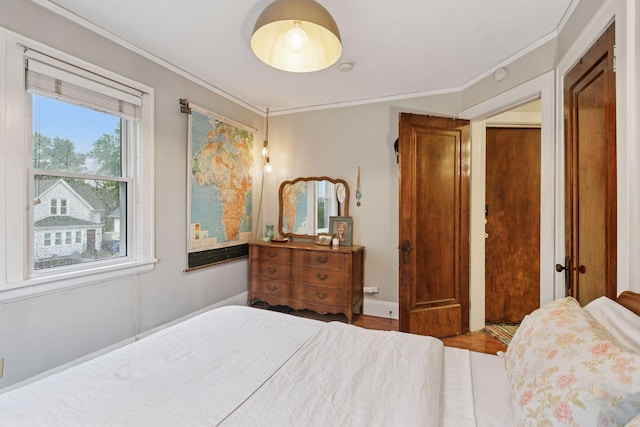285 Cliff St Unit 4, Saint Paul, MN 55102 - bedroom with crown molding, wood finished floors, and baseboards