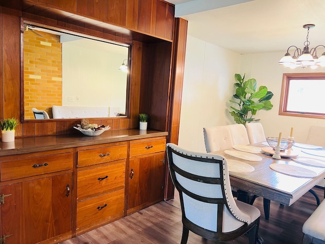 5117 Clear Spring Rd, Minnetonka, MN 55345 - dining area featuring wood finished floors and a chandelier