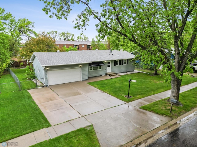 2207 16th St S, Fargo, ND 58103 - ranch-style home with an attached garage, concrete driveway, and roof with shingles